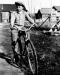Al Huble Junior riding his bike in 1926. 