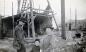 Bruce, Lloyd, and Mae Johnstone in Front of Construction.