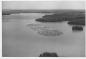 Log boom being towed down the Wabigoon River.