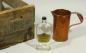 Dunrobin Brandy Bottle, Shipping Crate and 3 Quart Copper Measure from the Dunrobin Distillery