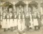 Group of young women in 'uniform' in front of the Fernside cottage.