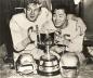 Jackie Parker and Normie Kwong celebrating with the Grey Cup.