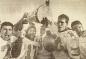 Laurier celebrating with the Yates Cup.