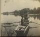 The Young sisters paddle the boat up the Mississippi to Church.