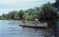 Twin sisters Shariffa and Natalie canoe on the Mississippi River just below the mouth of the Indian.