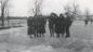 A group of skaters on the Indian river. A hockey game is on in the background.