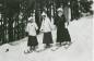Three women skiers in early ski attire, at Pink Lake, Gatineau Hills early 1900s 74.39.1.37