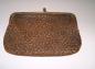 A mottled leather change purse donated by Ella Lewis