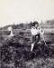 Ukrainian woman raking hay