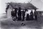 Ukrainian immigrant family in front of their house