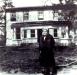 Elizabeth Harris, standing in front of Locust Lawn (Stephen Jones house)