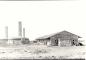 The Brick Plant with 3 smoke stacks, 6 kilns, a combination stock shed and bunkhouse. 