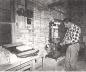 Dominion Fire Brick Plant chemist checking the strength of a brick on a hydraulic press in the lab. 