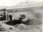 Fireman shovelling coal ashes out of a Kiln 1930's