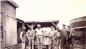 Employees in 1927 standing between the Plant (r) and a Kiln (l). 