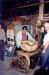 Ken Oakley (centre) demonstrates how the Bumping Stand in the Hand Mold shop was operated.