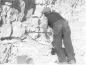 Drilling out a hole for dynamite in order to blast loose Clay