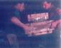 Hand Molders tamp a brick with a 2 man mold
