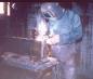 Ken Oakley welding on a Brick Die in the Machine Shop's Welding Room 