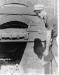 Ernie Nowatschka shovelling coal to a Kiln