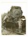 "Ernie Ottewell in front of the #5909 that ran through a rock slide . . ."