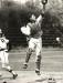 Halifax Capitals catcher leaps to catch ball as Truro Bearcat player runs by to score a run