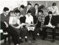 Members of the 1948 Halifax Capitals relax in the club house before getting ready for a game