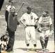 Umpire Johnny Fortunato calls for the resumption of play in a game between Truro and Halifax.