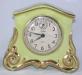 Another early china-cased mantel clock sold by the Snider Clock Corporation.