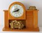 Electric fireplace wood mantel clock with small coloured light, Snider Clock Corporation.