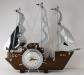 Rigged three-masted boat electric mantel clock with small lights, Snider Clock Corporation.