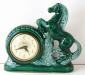 Dark green china-cased TV lamp electric clock, Snider Clock Corporation.