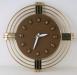 An electric wall clock with unusual hour markers, Snider Clock Mfg Co.