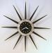 An early wooden-rays starburst electric wall clock, Snider Clock Mfg Co.