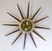 Starburst electric wall clock, long walnut cones, Snider Clock Mfg Co.