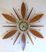 Alternating wooden petals and cones starburst electric wall clock, Snider Clock Mfg Co.