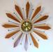 Wooden "neck ties" starburst electric wall clock, Snider Clock Mfg Co.