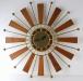 Flat, triangular wood rays, starburst electric clock, Snider Clock Mfg Co.