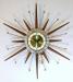 An elegant starburst electric wall clock, Snider Clock Mfg Co.