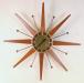 Fewer rays, starburst electric wall clock, Snider Clock Mfg Co.