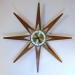 A third star-shaped starburst electric wall clock, Snider Clock Mfg Co.
