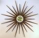 Large walnut-grained metal rays starburst battery wall clock, Snider Clock Mfg Co.