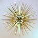 Dramatic brass-rays starburst electric clock, Snider Clock Mfg Co.