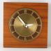 The square version of a simple, wood-frame electric wall clock, Snider Clock Mfg Co.