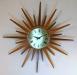 An older design starburst wall clock updated with flat rays, battery movement , Snider Clock Mfg Co.