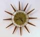 Plain-brass-dial version of earlier starburst wall clock model, electric, Snider Clock Mfg Co.