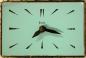 A painted flat metal dial on an electric desk/wall clock, Snider Clock Mfg Co.