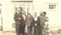 Members of the Green Family posing for a picture outside the family home.