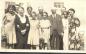 Members of the Green family posing in front of the family home.