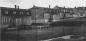 Rear view of duplex houses on east side of Cable Avenue.  Tennis court in foreground.